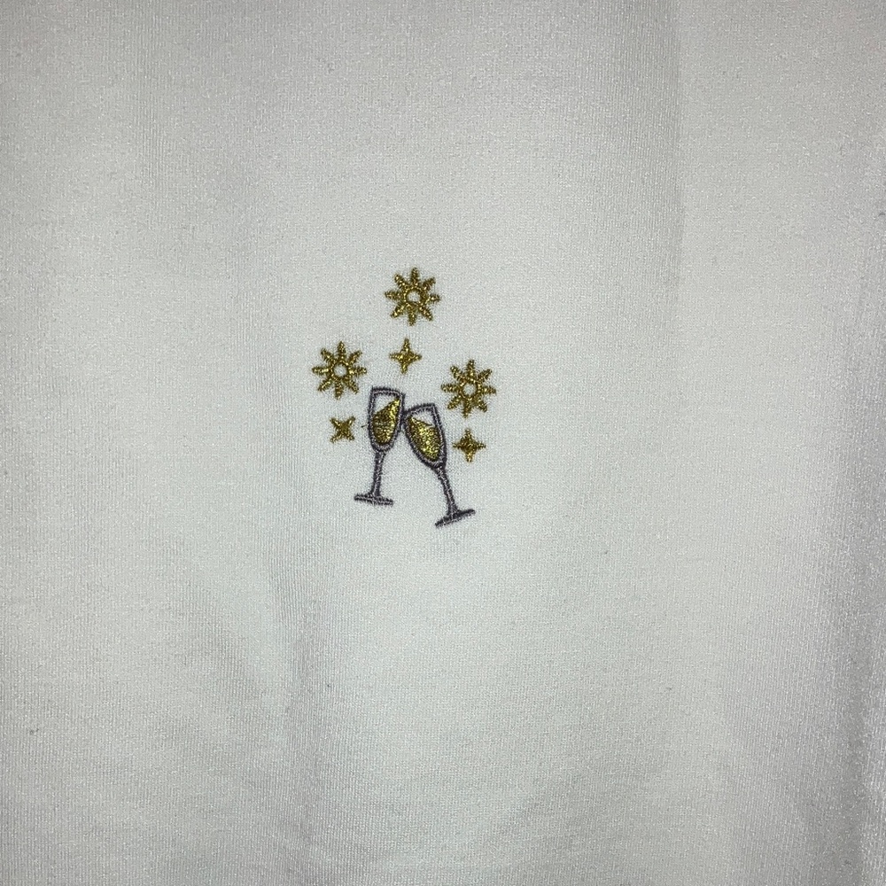 Elegant Cream V-Neck Sweater with Floral Accents - Picture 2 of 9